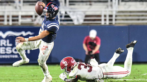 Ole Miss quarterback Matt Corral (2) avoids Alabama linebacker Dylan Moses (32) at Vaught-Hemingway Stadium in Oxford, Miss. on Saturday, October 10, 2020. (Bruce Newman)